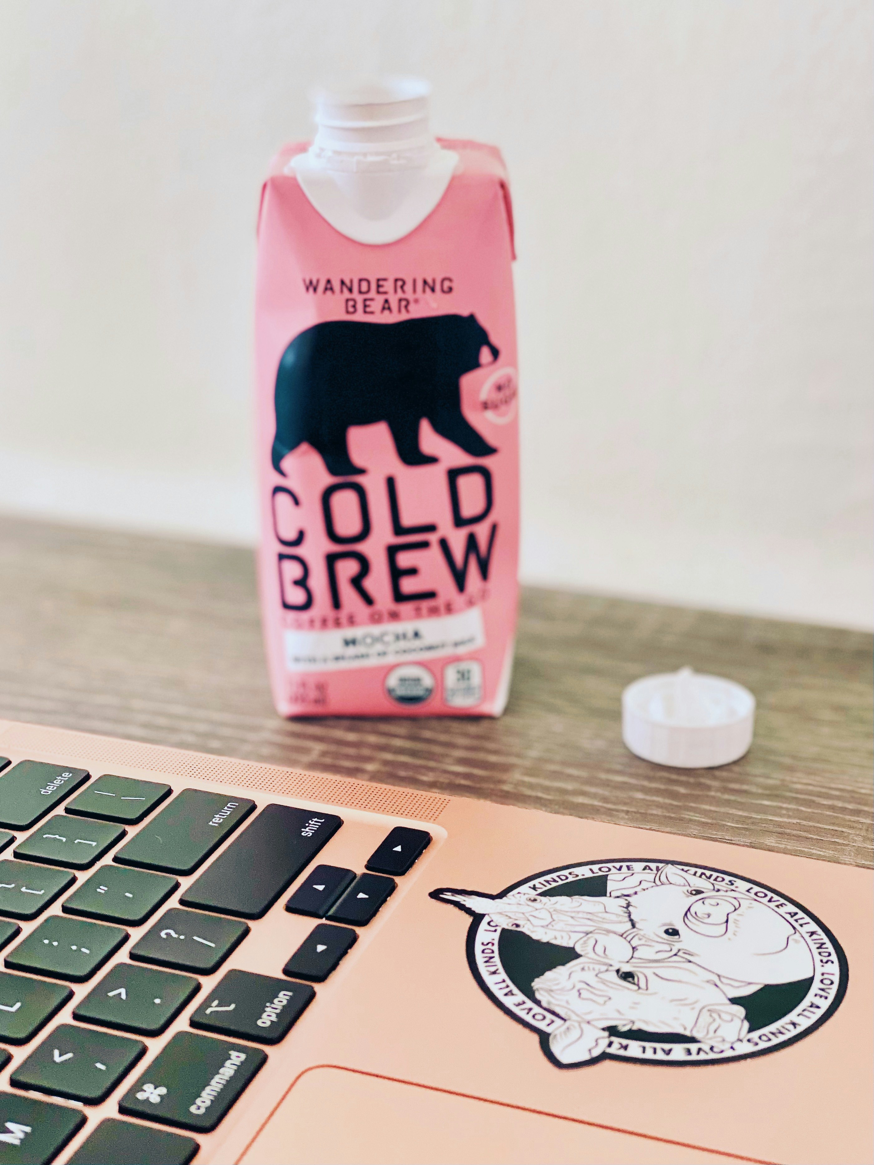 pink and white plastic bottle on white computer keyboard